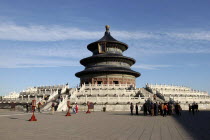 aka The Temple of Heaven. View of the Hall of Prayer for Good Harvests with people gathered at the base of the steps