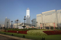 Modern city skyline seen over formal garden in the foreground