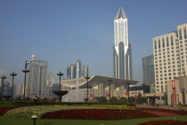 Modern city skyline seen over formal garden in the foreground