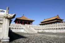 Small group of buildings in the complex on a raised level with steps leading up to them