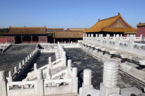 Small group of buildings in the complex on a raised level with steps leading up to them