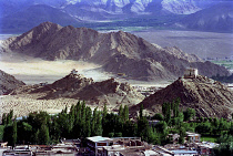 View toward distant hilltop Temples on the outskirts of the town against a backdrop of mountains