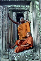 The Bayon. Novice devotees posing among the temple ruins