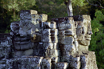 The Bayon. Two of the faces of the late twelth to early thirteenth century pyramid temple built in the centre of the ancient city of Angkor Thom