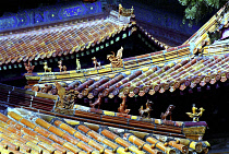 View along line of traditional style rooves with decorative features in the ancient grounds where Confucius practiced Qufu