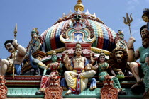 Sri Mariamman Temple. Detail of brightly coloured Hindu carvings and dome dating from 1862