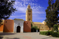 Koutoubia Mosque entrance gate and minaret with passing man