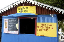 Fish House with menu board outside small opening