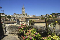 View over old town rooftops toward a church spire