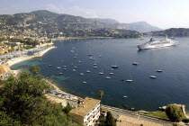 View over bay between Nice and Monte Carlo with moored Cruise ship and smaller boats