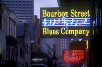 Bourbon Street.  Illuminated neon street signs.