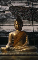 Wat Bupparam Temple on Tha Phae Road. Seated Golden Buddha statue shaded by large umbrella.bupharam Asian Prathet Thai Raja Anachakra Thai Religion Siam Southeast Asia Religious Siamese