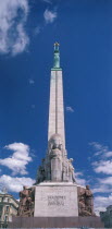 Freedom Monument. Green coloured copper statue on top of column