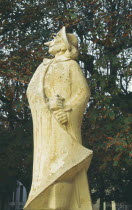 Restored statue of Cyrano De Bergerac in a small square in the Dordogne