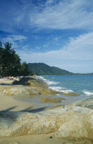 Lamai beach with rocks exposed at low tide