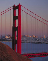 Golden Gate Bridge at dusk with city behind