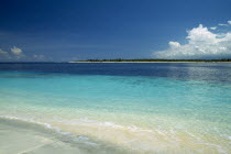 Gili Trawangan looking across clear water toward Gili Meno from the beach