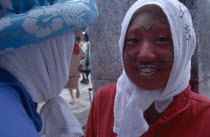 Harajuku District. Portrait of two young teenage girls wearing theatrical face makeup