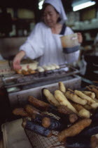 Close up of cooking sweetmeats in the kitchen with chef in the background