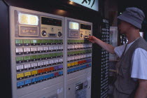 Shimbashi. Man using Restaurant Ticket vending machine