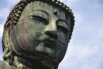 Angled view looking up at the head of the Daibutsu aka Great Buddha statue dating from 1252