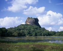 View over lily pond toward the Lion Rock monolith