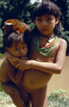 Acua indian brother and sister with pet Marmoset monkey