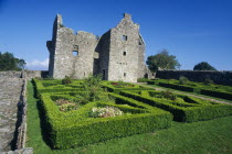 Tully Castle. Ruins of a fortified plantation house dating from 1610 with recently planted early 17th century style formal garden