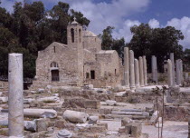 Twelth century Byzantine church.  Part restored exterior in area of fallen masonry and ruined remains of standing columns.