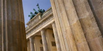 Brandenburg Gate. Angled view looking up through pillars toward the crowning statues