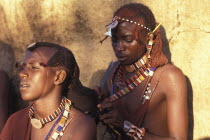 Maasai Moran platt each others hair prior to an initiation ceremony that will take them into manhood. The Moran live in age sets being brought up together like brothers.