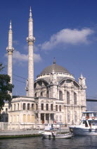 Ortakoy Mosque on the waterfront with moored boats in front