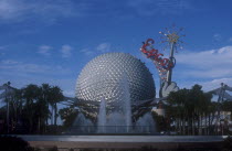 Walt Disney World Epcot. View of the Spaceship Earth with sparkling red Epcot sign and fountain at the base. **Editorial Use Only**