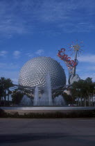 Walt Disney World Epcot. View of the Spaceship Earth with sparkling red Epcot sign and fountain at the base. **Editorial Use Only**