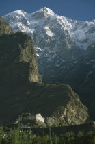 Fort built on a cliff side with Alter Mountains looming above