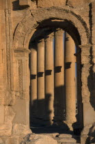 Monumental arch framing detail of colonnaded street Palmyra