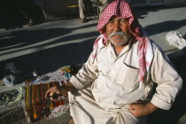 Prayer bead vendor on roadside.