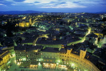 View across Siena at night.  The Piazza del Campo in the foreground.