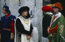 Group of young men in medieval costume in the Piazza del Campo.European Italia Italian Southern Europe Immature Male Man Guy Toscana Tuscan