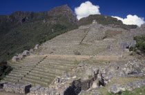 View across the ruins towards the mountains behind.  Cuzco