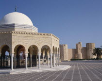 Bourguiba Mausoleum portico with white dome and Ribat Fortress behind