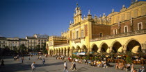 Rynek Glowny or Grand Square and the sixteenth century Renaissance Cloth Hall lined with busy cafes.