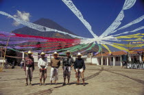 Charismatic church festival with five local men standing under streamers