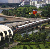 MRT Mass Rapid Transport Train Nr Kallang Station On Kallang River. Road Traffic On Sir Arthurs Bridge. Apartment Blocks. J6828