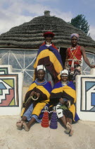 Ndebele women in traditional dress outside the arts and crafts shop at White River near Middelburg