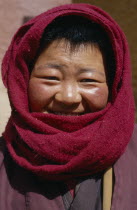 Buddhist Nun wearing a head scarf