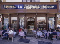 Santa Cruz District  La Campana the most famous Pasteleria cake shop with people sitting at tables on the pavement