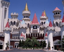 Excalibur Hotel and Casino. Chateau facade of hotel entrance with pink and gold turrets.