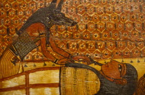 Painting on wooden coffin. Jackal Headed God Anubisover reclining figure