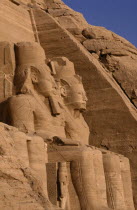 Two of the giant statues of Ramesses II at the entrance to the Great Temple